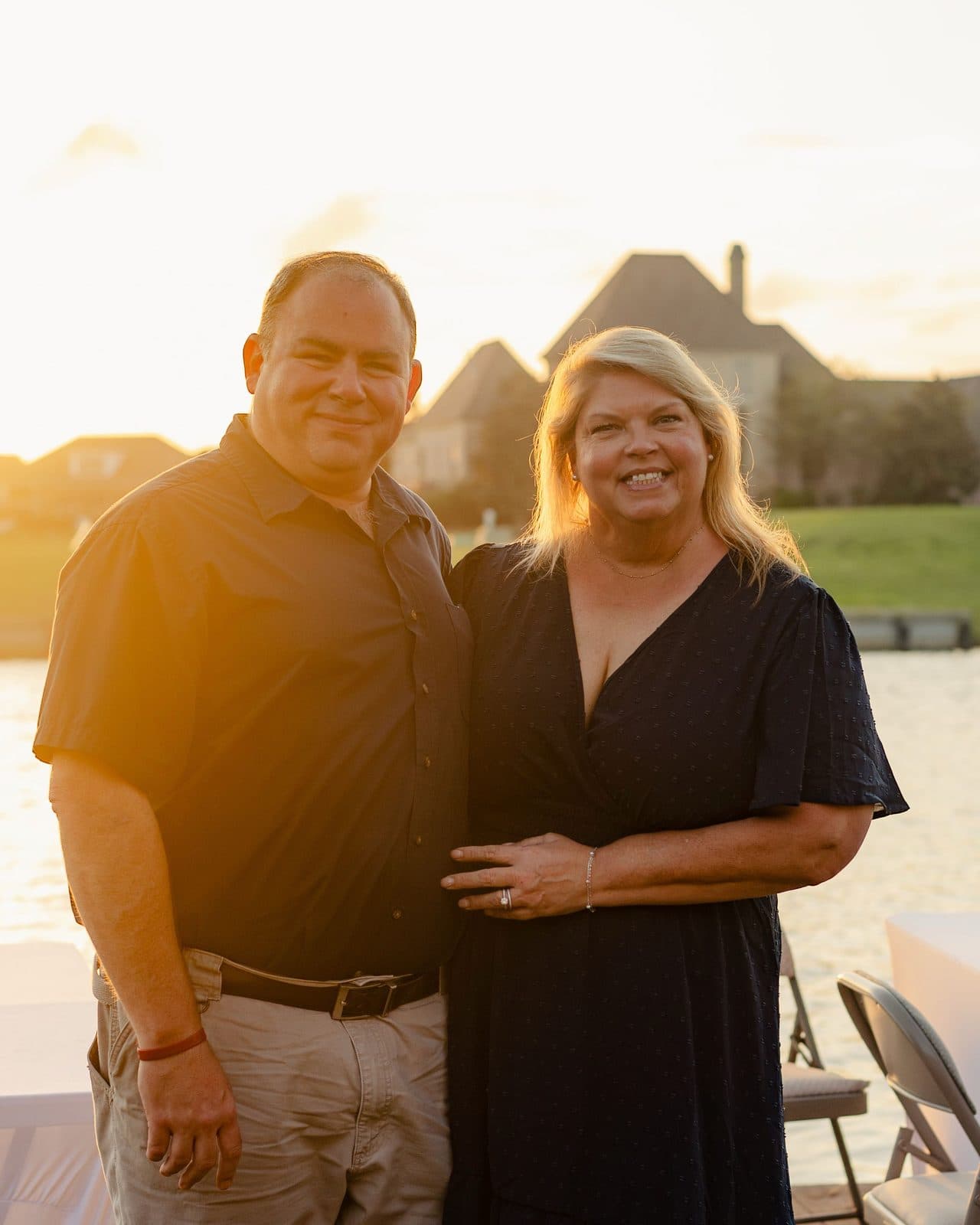 Marshall Naquin with his wife, Tracey, on a dock at sunset